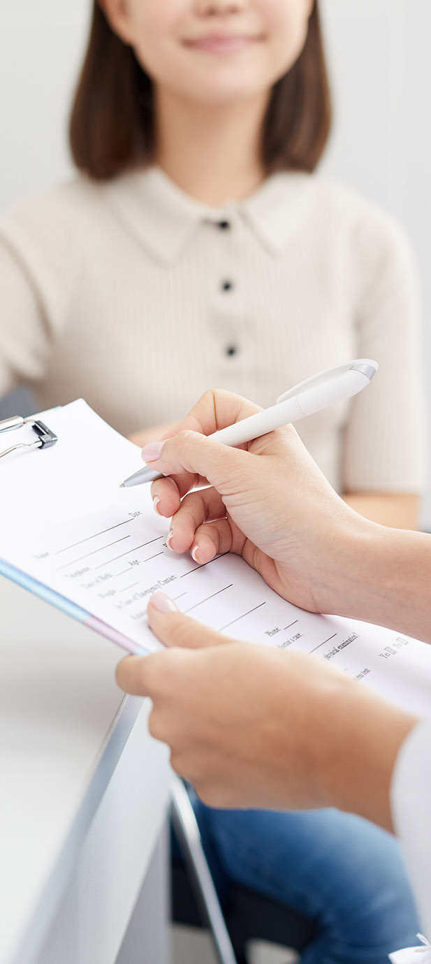 Doctor Writing on Clipboard